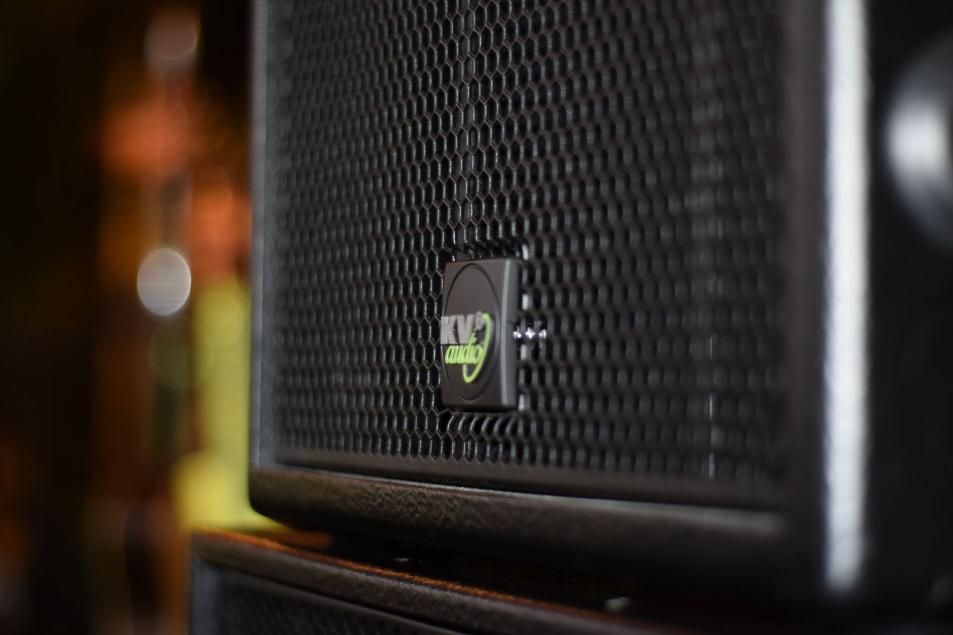 Tần số âm thanh là gì (Hz, dải bass-mid-treble) - Detailed shot of a KV2 audio speaker showcasing its design in an indoor setting.