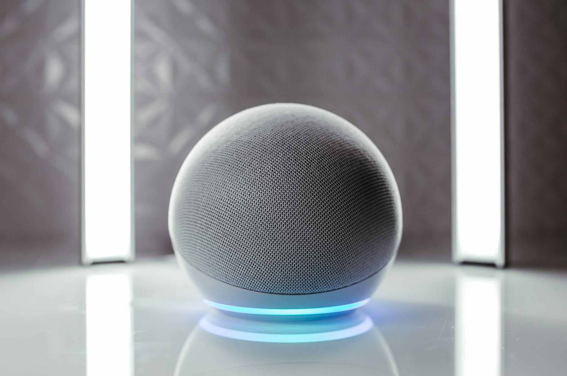 Cách Thay Côn Loa (Voice Coil) Bị Cháy - Close-up of a spherical smart speaker with illuminated base, perfect for modern interiors.